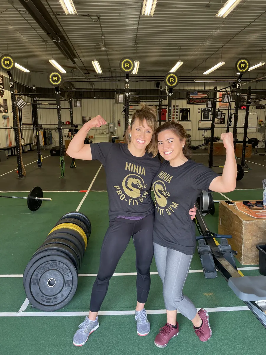 Two members wearing the Ninja rank shirts they earned